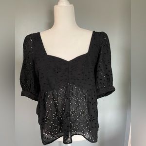 American Eagle top size large in black with eyelet cut pattern lined in chest